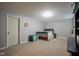 Spacious bedroom with a dark wood crib, and large carpeted floor at 13884 Wendessa Dr, Fishers, IN 46038