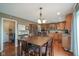 Well-equipped kitchen featuring stainless steel appliances, wood cabinets, granite countertops, and island at 13884 Wendessa Dr, Fishers, IN 46038