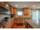 This kitchen features stainless steel appliances, wood cabinets, granite countertops, and natural light at 13884 Wendessa Dr, Fishers, IN 46038