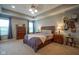 Main bedroom with tray ceiling, dresser, bedside tables and carpet flooring at 13884 Wendessa Dr, Fishers, IN 46038
