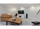 Finished basement featuring a modern entertainment setup and comfortable seating at 1393 Stoney Creek Cir, Carmel, IN 46032