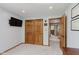 Bright bedroom with wood doors, including a large closet, and view into the hallway at 1393 Stoney Creek Cir, Carmel, IN 46032