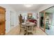 Cozy breakfast nook adjacent with seating for four and easy access to a sunroom at 1393 Stoney Creek Cir, Carmel, IN 46032