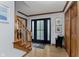 Welcoming foyer featuring wood flooring, a staircase, and a modern front door with sidelights at 1393 Stoney Creek Cir, Carmel, IN 46032