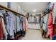 Organized walk-in closet with ample hanging space and shelving for storage at 1393 Stoney Creek Cir, Carmel, IN 46032
