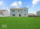 Large grassy backyard featuring ample space for outdoor activities and relaxation at 1456 Willow Tree Ln, Sheridan, IN 46069