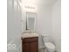 Cozy half bathroom with vanity and updated fixtures at 1456 Willow Tree Ln, Sheridan, IN 46069