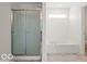 Bright bathroom features a separate shower and bathtub at 1456 Willow Tree Ln, Sheridan, IN 46069