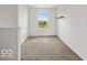Bright bedroom with a view of the neighborhood and the sky at 1456 Willow Tree Ln, Sheridan, IN 46069