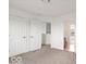 Bedroom with two doors and neutral carpeting at 1456 Willow Tree Ln, Sheridan, IN 46069