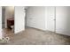 Bedroom with ensuite bathroom featuring neutral walls and carpet, and white trim at 1456 Willow Tree Ln, Sheridan, IN 46069