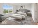 Bright bedroom featuring a neutral palette, natural light, and a view of the pond at 1456 Willow Tree Ln, Sheridan, IN 46069