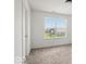 A bright carpeted bedroom features a double window with a view of the neighborhood at 1456 Willow Tree Ln, Sheridan, IN 46069