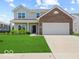 Charming two-story home with a well-maintained lawn and a two-car garage at 1456 Willow Tree Ln, Sheridan, IN 46069