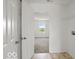 Hallway to bedroom featuring open doors at 1456 Willow Tree Ln, Sheridan, IN 46069