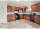 Functional kitchen with dark appliances, and practical layout at 1456 Willow Tree Ln, Sheridan, IN 46069