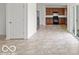 Open-concept kitchen boasts wooden cabinetry, modern appliances, and plenty of countertop space at 1456 Willow Tree Ln, Sheridan, IN 46069