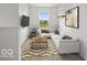 Modern staged living room with cozy seating at 1456 Willow Tree Ln, Sheridan, IN 46069