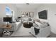Staged living room with modern furniture and decor at 1456 Willow Tree Ln, Sheridan, IN 46069
