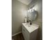 Bright bathroom featuring a modern vanity with a white countertop and stylish lighting fixture at 1540 Roanoke Dr, Zionsville, IN 46077