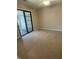 Bedroom featuring neutral carpet and sliding glass doors to an enclosed patio at 1540 Roanoke Dr, Zionsville, IN 46077