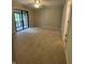 Spacious bedroom with neutral carpet and sliding glass doors leading to an outdoor space at 1540 Roanoke Dr, Zionsville, IN 46077