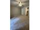 Carpeted bedroom with ceiling fan and ensuite bathroom with cabinets and fixtures at 1540 Roanoke Dr, Zionsville, IN 46077