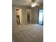 Spacious bedroom with ensuite bathroom, walk-in closet, ceiling fan, and sliding glass doors at 1540 Roanoke Dr, Zionsville, IN 46077