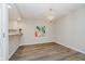 Cozy dining area featuring modern lighting and stylish flooring at 1540 Roanoke Dr, Zionsville, IN 46077