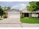 Charming single-story home with attached garage and a well-maintained lawn at 1540 Roanoke Dr, Zionsville, IN 46077