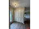 Bright foyer with wood-look floors, double closet doors, and front door with decorative glass at 1540 Roanoke Dr, Zionsville, IN 46077
