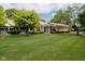 Well-maintained front lawn with a brick home featuring a covered entrance at 1540 Roanoke Dr, Zionsville, IN 46077