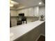 Bright eat-in kitchen featuring white cabinets, quartz countertops, and modern appliances at 1540 Roanoke Dr, Zionsville, IN 46077