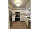 Bright kitchen featuring stainless steel appliances, modern finishes, and white cabinetry at 1540 Roanoke Dr, Zionsville, IN 46077