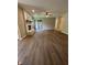 Spacious living room with wood flooring, fireplace, and sliding glass doors to the exterior at 1540 Roanoke Dr, Zionsville, IN 46077