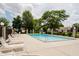 Community outdoor pool with plenty of seating and mature trees at 1540 Roanoke Dr, Zionsville, IN 46077