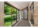 Sun room overlooking the front yard featuring plenty of windows and sliding glass doors for access to outside at 1540 Roanoke Dr, Zionsville, IN 46077