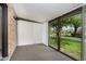 Cozy sunroom with brick accent wall, carpeting, natural light and neighborhood views at 1540 Roanoke Dr, Zionsville, IN 46077