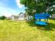 A spacious backyard with lush green grass and a charming blue swing set at 1688 Magnolia Dr, Greenwood, IN 46143