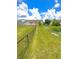 Expansive backyard with a secure fence, lush green lawn, and picturesque landscaping, offering privacy and tranquility at 1688 Magnolia Dr, Greenwood, IN 46143