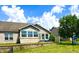 Serene backyard featuring a brick home with a cozy outdoor seating area and well-maintained green space at 1688 Magnolia Dr, Greenwood, IN 46143