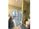 Bathroom with shower and toilet, blue rugs, and view into the bedroom at 1688 Magnolia Dr, Greenwood, IN 46143