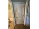 Bathroom door adjacent to bedroom doors, granting privacy and convenience at 1688 Magnolia Dr, Greenwood, IN 46143