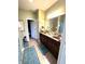 Bathroom featuring double vanity, framed mirrors, and wood cabinets at 1688 Magnolia Dr, Greenwood, IN 46143