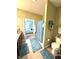Bathroom with shower and toilet, blue rugs, and view into the bedroom at 1688 Magnolia Dr, Greenwood, IN 46143