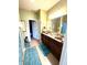 Bathroom featuring double vanity, framed mirrors, and wood cabinets at 1688 Magnolia Dr, Greenwood, IN 46143