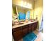 Bathroom featuring a double sink vanity with a large mirror and plenty of counter space at 1688 Magnolia Dr, Greenwood, IN 46143