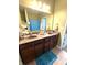 Bathroom featuring a double sink vanity with a large mirror and plenty of counter space at 1688 Magnolia Dr, Greenwood, IN 46143