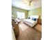 Bright bedroom with neutral carpet, ceiling fan, large window, and stylish furnishings at 1688 Magnolia Dr, Greenwood, IN 46143