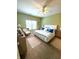 Spacious bedroom with neutral carpet, a ceiling fan, and a bright window at 1688 Magnolia Dr, Greenwood, IN 46143